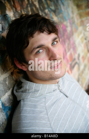 Unemployed male aged 22 looking depressed and bored Stock Photo