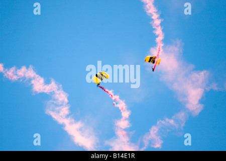 Members of the Golden Knights parachute team zip across the sky above Andrews Air Force Base in Suitland, Maryland. Stock Photo