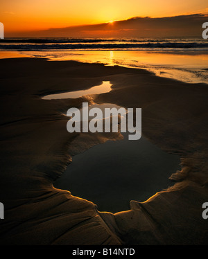 Dramatic sunset at Sennen Cove in Cornwall. Stock Photo