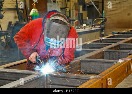 Metal workers in a factory Stock Photo