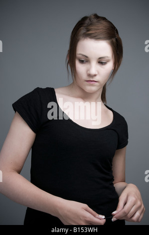 moody teenage girl looking sad and depressed Stock Photo