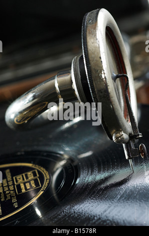 An old fashioned portable gramophone playing a record