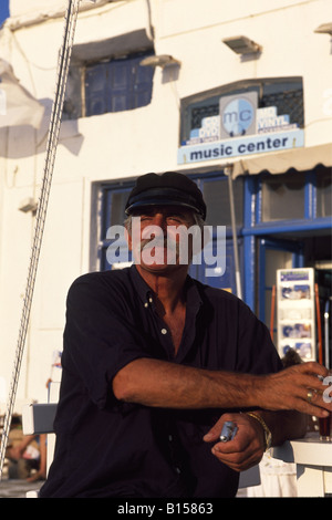 Fisherman at the port of Mykonos Town Mykonos Island Cyclades Greece Stock Photo