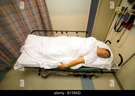 A patient in an Orange CA hospital emergency room has been placed in the rescue position for shock with legs raised Stock Photo
