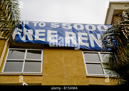 Free Rent signs at a newly built office residential complex in Orange California reflect a depressed real estate market Stock Photo