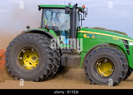 John Deere 8230 tractor in use on a farm in Bawdsey, Suffolk, UK. Stock Photo