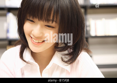 Smiling Japanese young woman Stock Photo