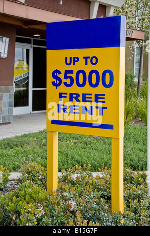 Free Rent signs at a newly built office residential complex in Orange California reflect a depressed real estate market Stock Photo