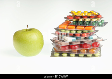 Tablets and capsules in blister packs by apple Stock Photo