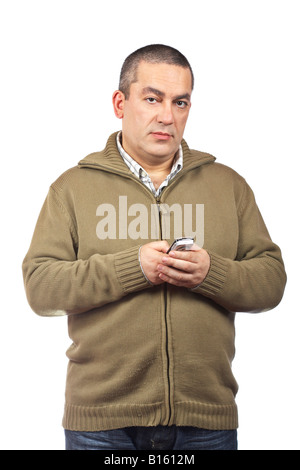 Casual man sending sms with cell phone over a white background Stock Photo