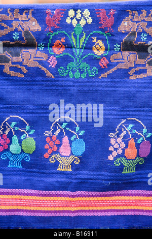 Brightly coloured fabric woven by a Mayan woman Stock Photo