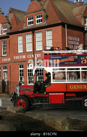 City of Chester, England. The Chester Heritage tour bus conducting city tours for visitors passing the Chester Visitors Centre. Stock Photo