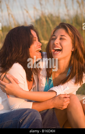 Asian mother and daughter laughing Stock Photo