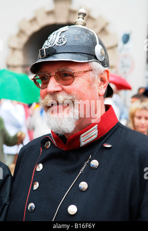 Bearded elderly gentleman dressed in WW1 Austrian army uniform with blue tunic and battered black helmet in the Alte Burg Stock Photo