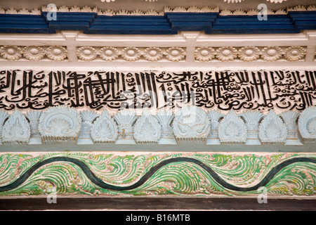 Calligraphy and ornate carving in the ceilings of one of the mosques in the matriarchal Muslim area of Kuttichira, Kozhikode. Stock Photo