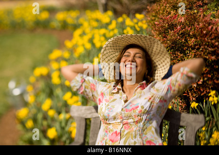 Hispanic woman wearing sun hat Stock Photo