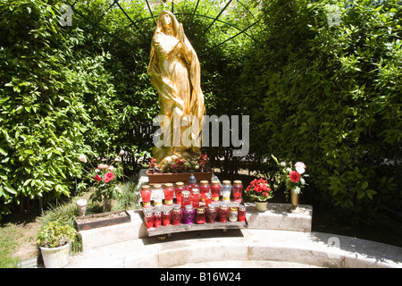 Opatija Istria Croatia Europe May gilded statue of Madonna in front of Saint Jacob s Church in St Jacob's Park Stock Photo