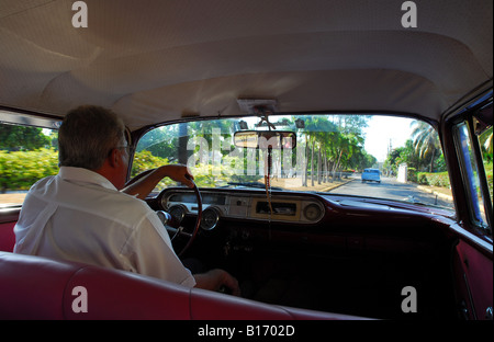 Interior view - Classic American Pontiac Star Chief car drives through Havana Cuba Stock Photo