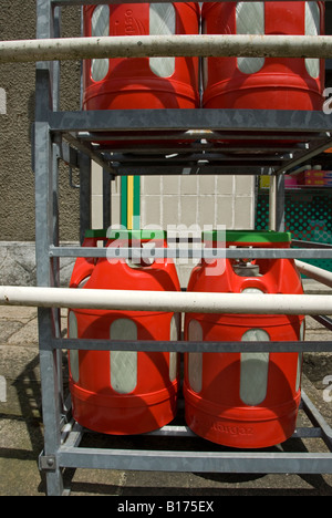 Stock photo of Gas bottles in a cage outside a shop in France Stock Photo