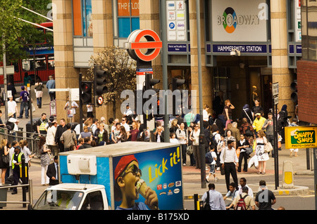 England, London, Hammersmith tube station, pedestrians on busy street crossing Stock Photo