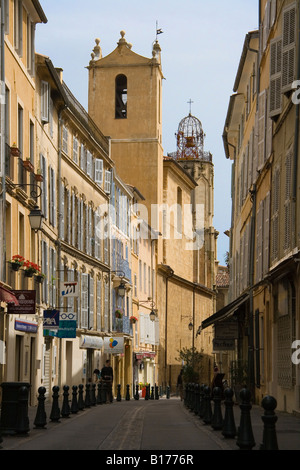 One of the streets in the old town of Aix en Provence, France, showing traditional architecture and the Church of Augustins. Stock Photo