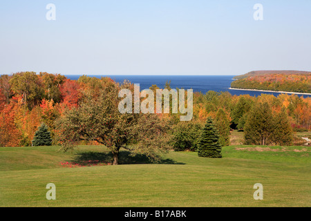 APPLE TREE AUTUMN FOREST AND THE BLUE WATERS OF LAKE MICHIGAN IN ELLISON BAY DOOR COUNTY WISCONSIN MIDWESTERN USA Stock Photo
