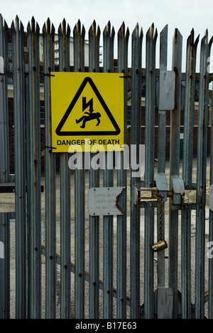 Danger of death sign on high security fence