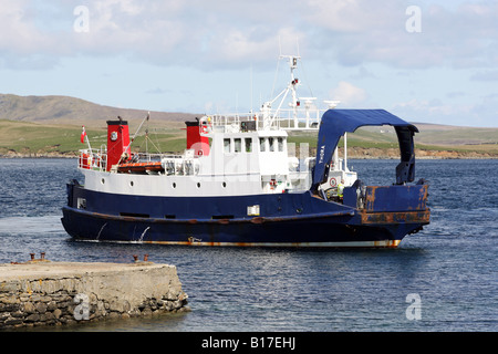 The ferry Thora sailing between the islands of Yell and Unst in the Shetland Islands, UK Stock Photo