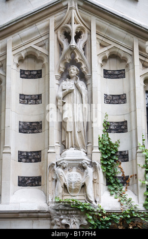 A statue of St Bartholomew on the church exterior of St Bartholomew the Great Church, West Smithfield, City of London EC1 Stock Photo