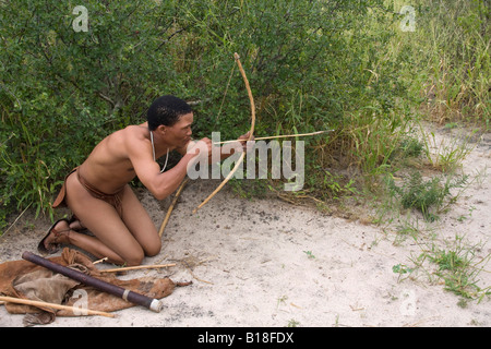 The Bushmen are the oldest inhabitants of southern Africa using a bow and arrow Stock Photo