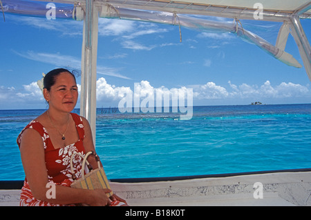 Native Rangiroa lagoon woman on boat on lagoon, Rangiroa atoll, Tuamotu archipelago, South Pacific Ocean Stock Photo