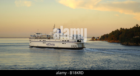 BC Ferries Queen of Vancouver exiting Active Pass headed for Tsawwassen on the British Columbia mainland. Georgina Point Lightho Stock Photo