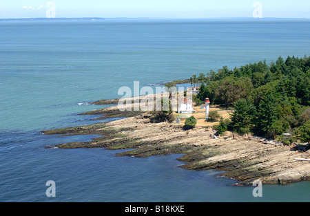 The Georgina Point Lighthouse at the entrance to Active Pass, Mayne Island, BC. Aerial photography of the Southern Gulf Islands. Stock Photo