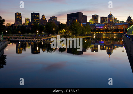 Downtown Montreal seen from the Bonsecours Basin in Old Montreal and Old Port at night, Montreal, Quebec, Canada. Stock Photo