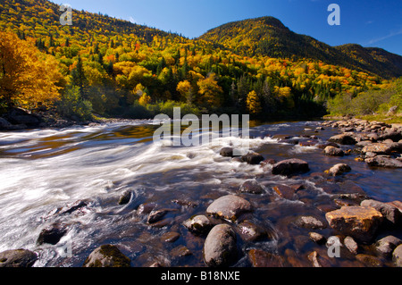 Riviere Jacques-Cartier, Jacques Cartier River, and valley surrounded by fall colours in Parc de la Jacques-Cartier, Quebec, Can Stock Photo