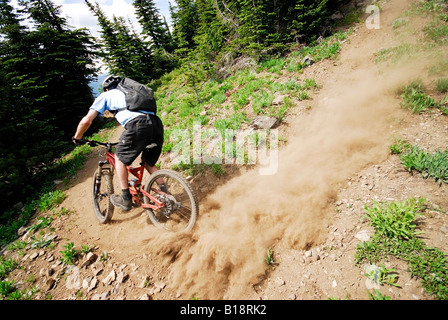 Man bikes the Seven Summits trail, Rossland, British Columbia, Canada Stock Photo