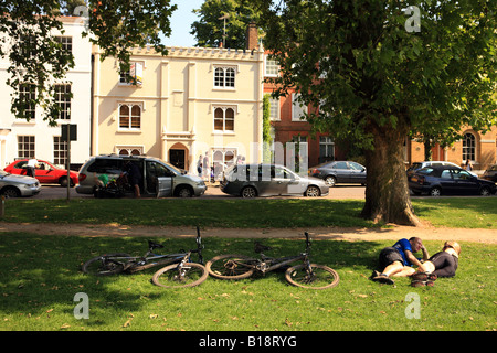 Cyclists relaxing in the shade, on a sunny day. Stock Photo
