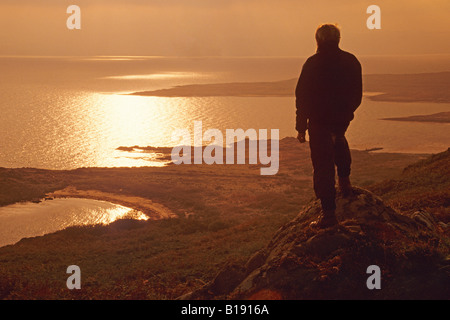 sunset over Port Ban at the northern end of the Isle of Gigha Stock Photo