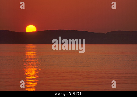 sunset over the Isle of Gigha Stock Photo