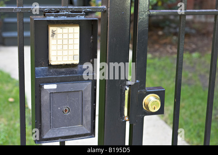 ILLINOIS Chicago Locked metal gate entrance to home in Bucktown neighborhood, Wicker Park intercom system Stock Photo