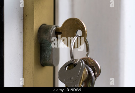 Door keys in the lock Stock Photo
