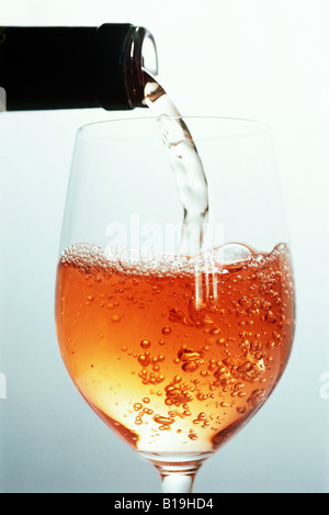 Rose wine being poured Stock Photo