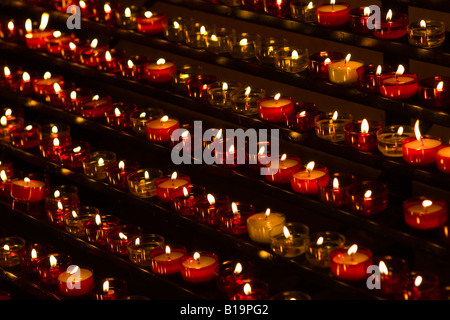 Row of small burning candles as offerings in a church, Notre Dame de la Garde, Marseille, France, Europe Stock Photo