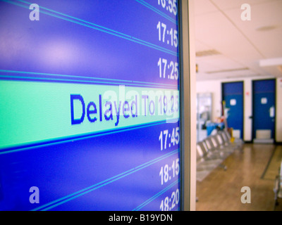 Flight delayed information at an airport Stock Photo