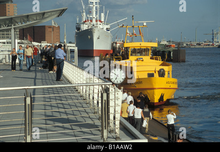 A harbour ferry on the river Elbe at the St. Pauli Landungsbruecken in Hamburg, Germany Stock Photo