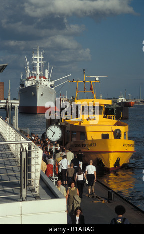 A harbour ferry on the river Elbe at the St. Pauli Landungsbrücken in Hamburg, Germany Stock Photo
