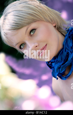 Portrait of young woman with ribbon around her neck Stock Photo