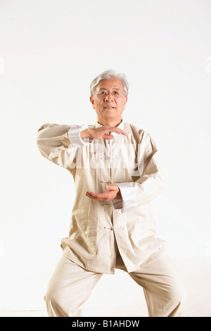 One senior adult doing Tai Chi Stock Photo