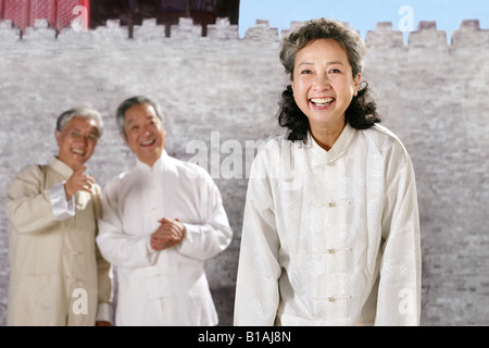 three oriental senior adults doing Taijiquan Stock Photo