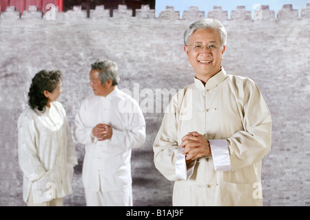 three oriental senior adults doing Taijiquan Stock Photo